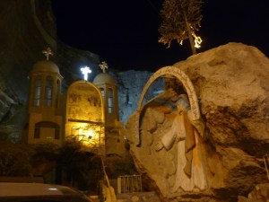 The entrance to a church, carved into a cave. It is a magnificent modern facility on an ancient Coptic site, where God saved his people by splitting the mountain in half.