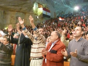One of the purposes of the event, besides praying for Egypt, was to broadcast the love Copts have for their nation. Note how many Egyptian flags filled the auditorium.