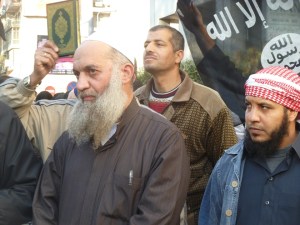 As he hung around for hours, eventually the crowds dissipated around him. Here is awaits giving an interview to al-Jazeera.