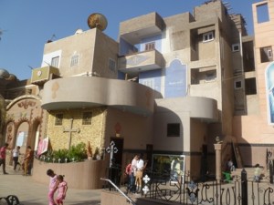 Homes in Saragna pushing up against the massive new church recently built. Some homes were purchased and destroyed to make room.