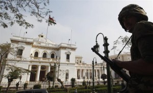 A soldier stands guard outside the parliament building during a meeting between U.S. Secretary of State Clinton and Egyptian Prime Minister Sharaf in Cairo