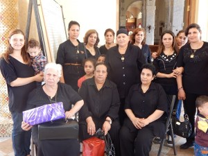 Relatives of the martyrs, dressed in black.