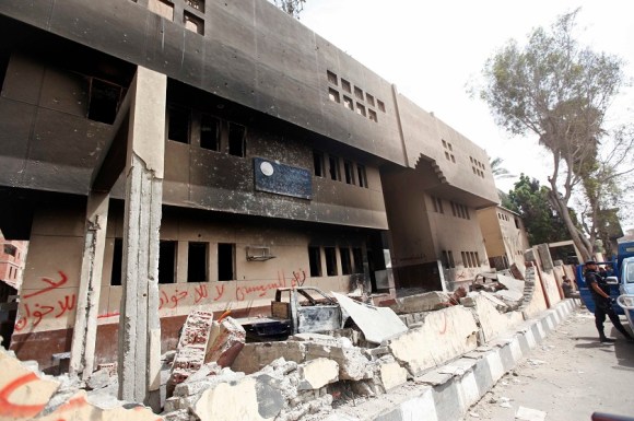 A view shows a damaged police station burnt in a blaze by supporters of former president Mohamed Mursi in Kerdasa, a town 14 km (9 miles) from Cairo in this September 19, 2013 file photograph. REUTERS/Mohamed Abd El Ghany