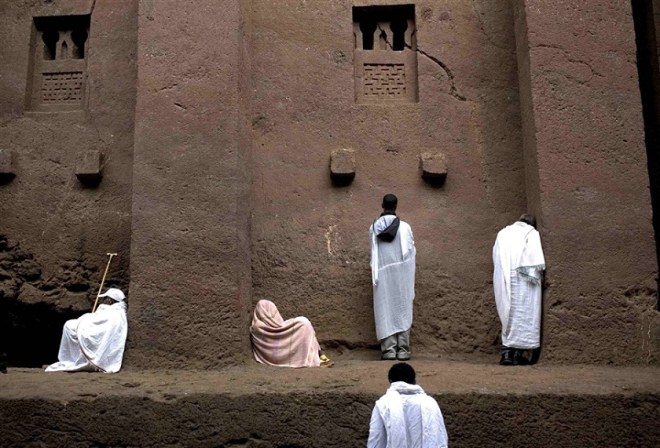 Ethiopian Christians at prayer at a rock-cut church, via NBC news photo blog.